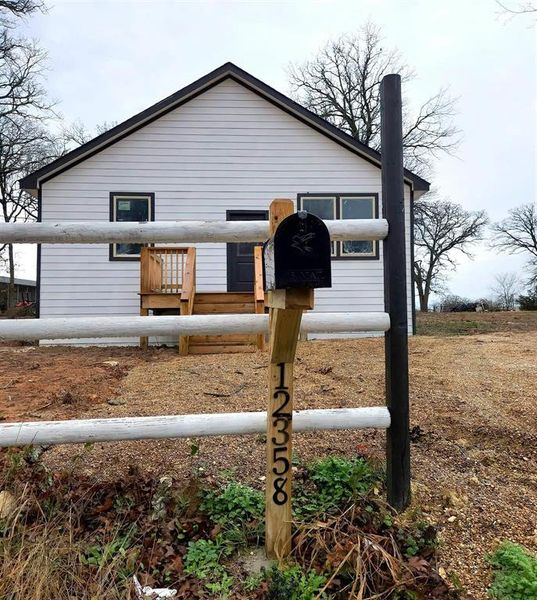 Front exterior of a new home in , Kemp, TX, highlighting curb appeal (Image 14).