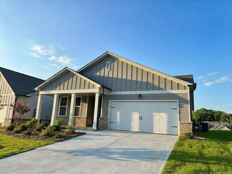 Front exterior of a new home in Kelly Preserve, Loganville, GA, highlighting curb appeal (Image 19).