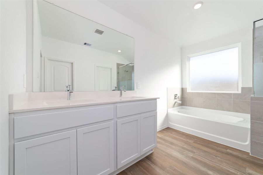 Furnished interior view inside a new home in Sunterra, Katy (Image 11).