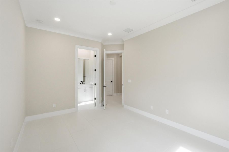 Spacious, unfurnished interior of a new home in The Strand, Vero Beach (Image 22).