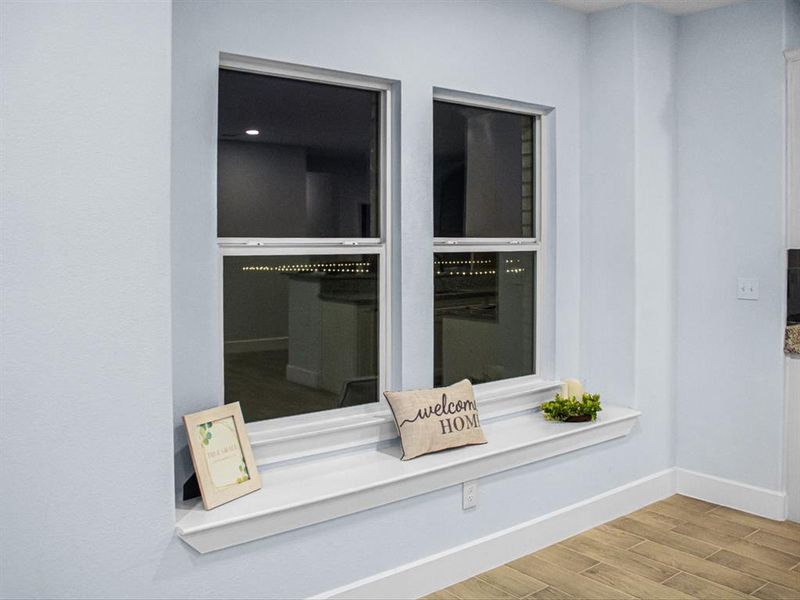 Detailed view of baseboards and wood finished floors