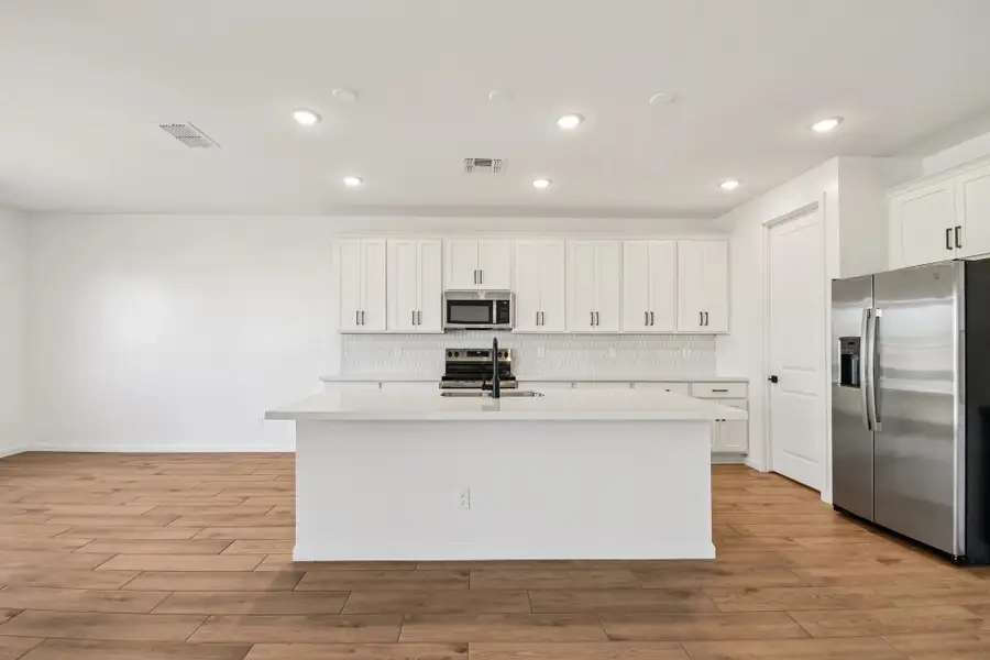 Kitchen featuring the Harmony Collection. Not actual home, finishes may vary by community. Kitchen featuring the Harmony Collection. Not actual home, finishes may vary by community.