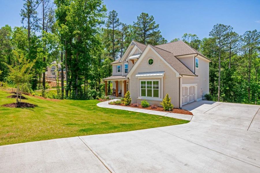 Front exterior of a new home in Liberty Springs, Woodstock, GA, highlighting curb appeal (Image 2).