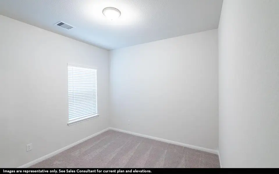 Empty room featuring visible vents, baseboards, and light colored carpet