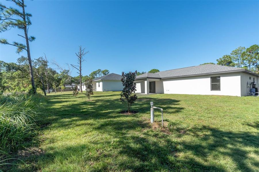 Exterior details and patio area of a home in , North Port (Image 24).