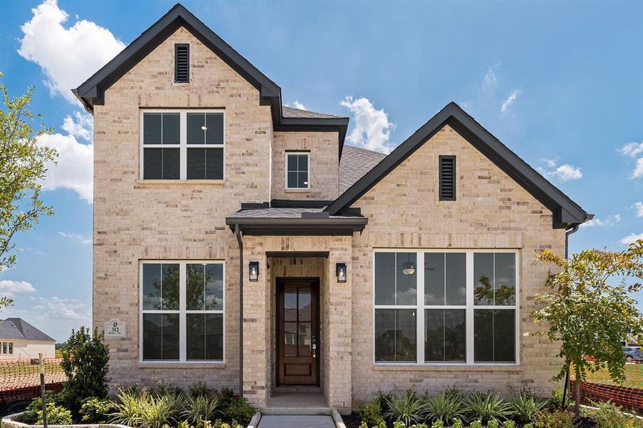 View of front of house featuring brick siding and a shingled roof View of front of house featuring brick siding and a shingled roof