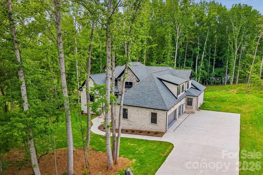 Front exterior of a new home in , Waxhaw, NC, highlighting curb appeal (Image 25).