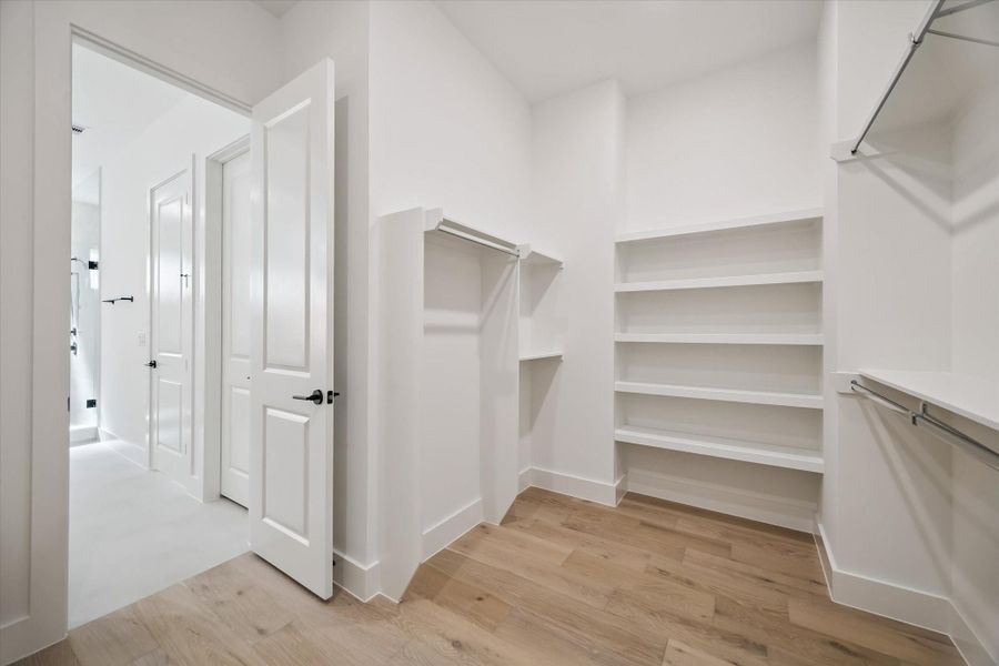 Your primary suite has a large walk-in closet with plenty of built-ins.