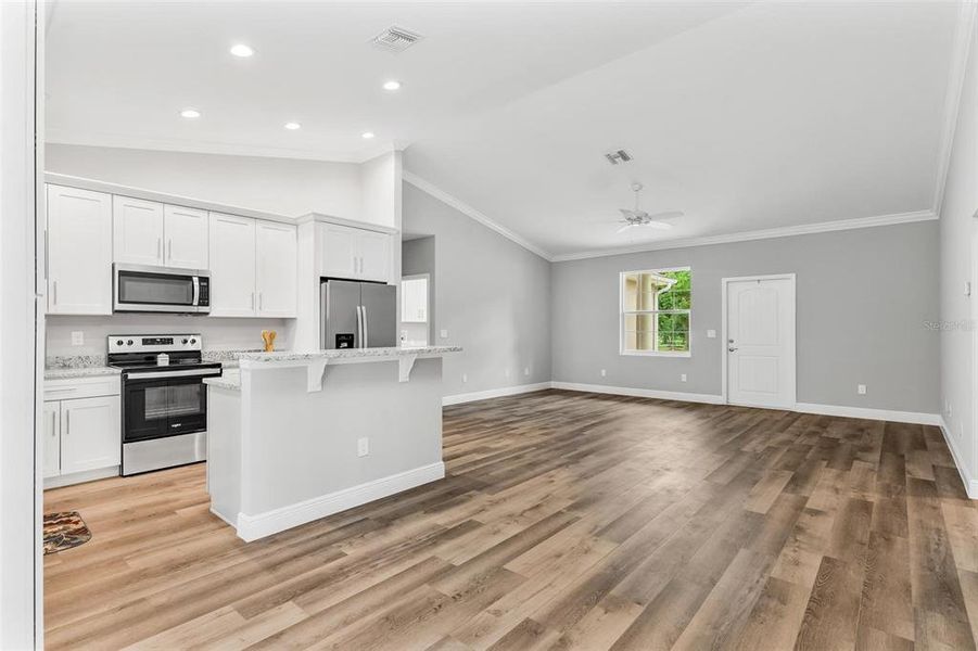 Dining Area overlooking Kitchen and Living Area