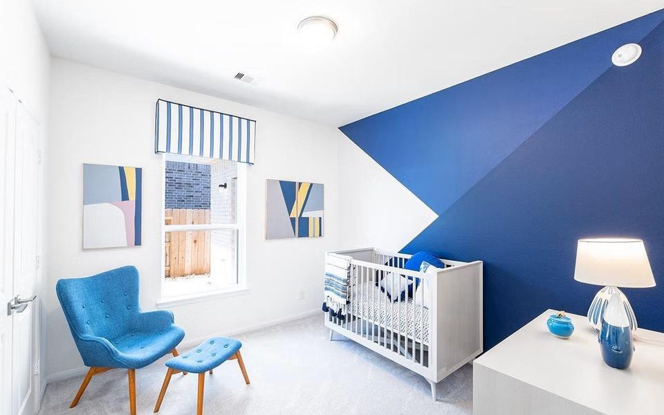 Versatile bedroom space filled with natural light, ideal for a nursery, playroom, or quiet study, offering flexibility to fit your lifestyle as your needs change. **Photos are representative only and may vary as built.**