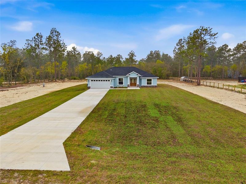 Front exterior of a new home in , Ocala, FL, highlighting curb appeal (Image 19).