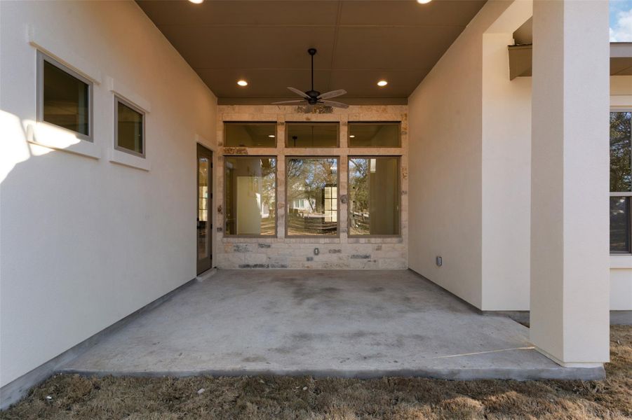 View of patio featuring a ceiling fan