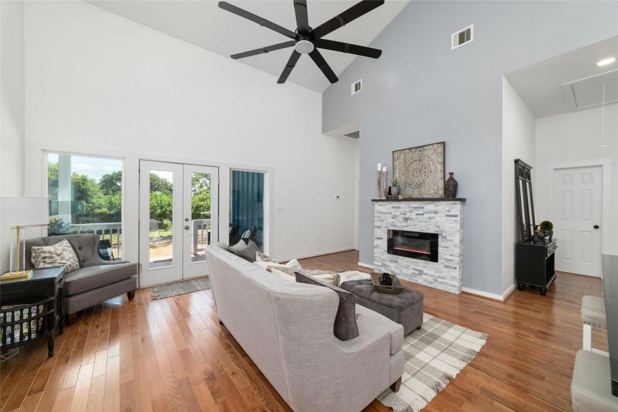 This inviting living area features hardwood floors, a soothing gray accent wall, ample natural light and a electric fireplace. This inviting living area features hardwood floors, a soothing gray accent wall, ample natural light and a electric fireplace.