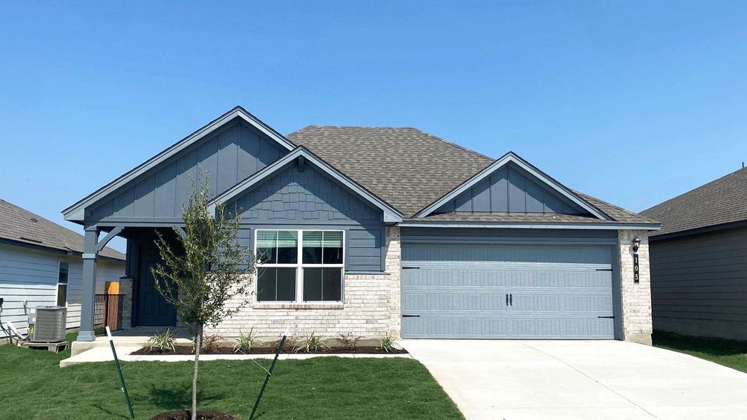 Front exterior of a new home in Eastern Wells, Jarrell, TX, highlighting curb appeal (Image 1). Front exterior of a new home in Eastern Wells, Jarrell, TX, highlighting curb appeal (Image 1).