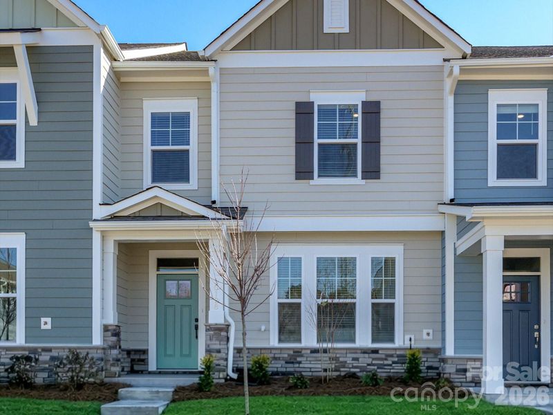 Front exterior of a new home in North Creek Village, Huntersville, NC, highlighting curb appeal (Image 20).