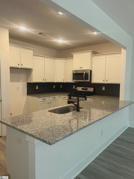 Furnished interior view inside a new home in Parkstone Place Townhomes, Roebuck (Image 5).