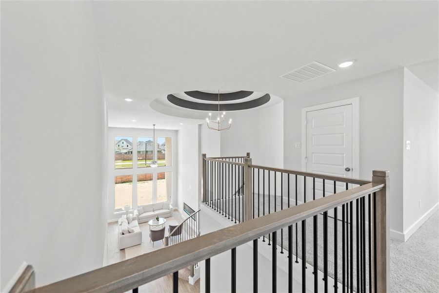 Furnished interior view inside a new home in Sunterra, Katy (Image 11).