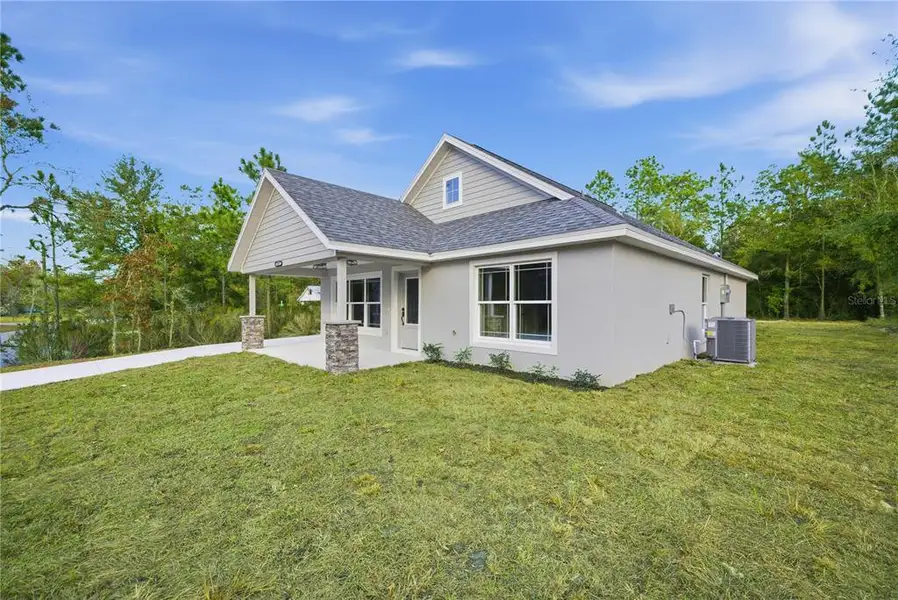 Exterior details and patio area of a home in , Williston (Image 3).
