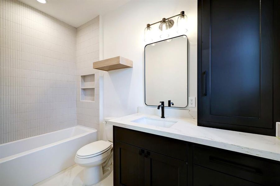 Enjoy the convenience and privacy of direct bathroom access from the second guest bedroom.