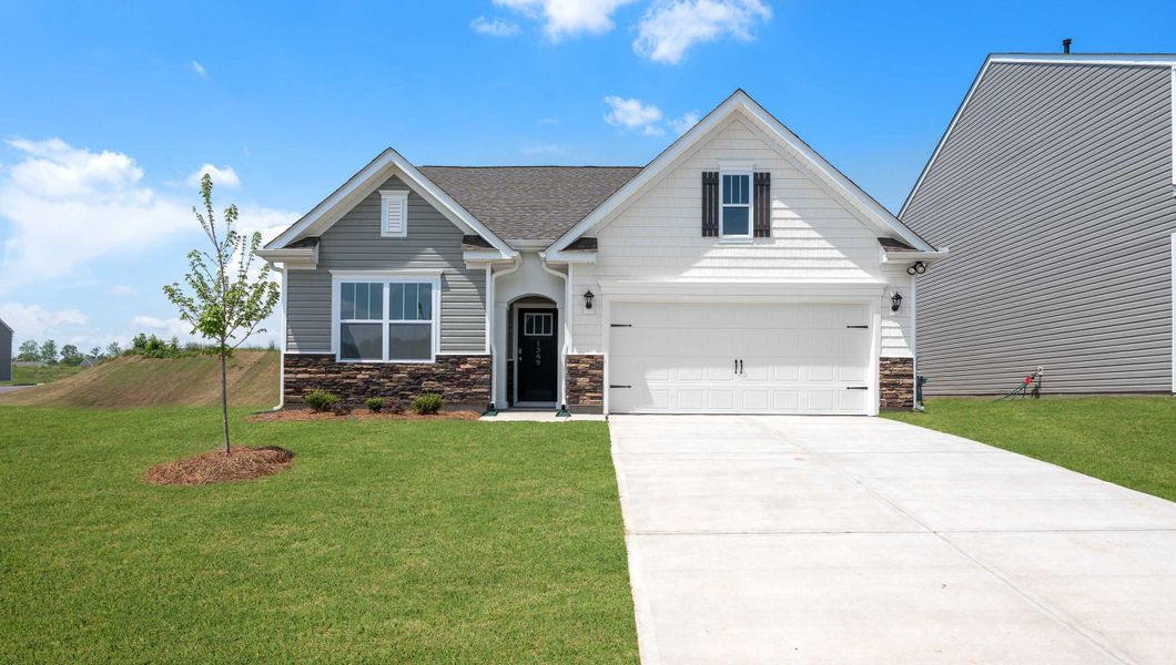 Front exterior of a new home in Durbin Meadows Traditions, Fountain Inn, SC, highlighting curb appeal (Image 1). Front exterior of a new home in Durbin Meadows Traditions, Fountain Inn, SC, highlighting curb appeal (Image 1).