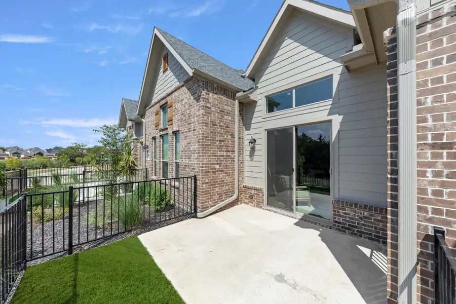 Exterior details and patio area of a home in Cottonwood Creek, Rowlett (Image 3).