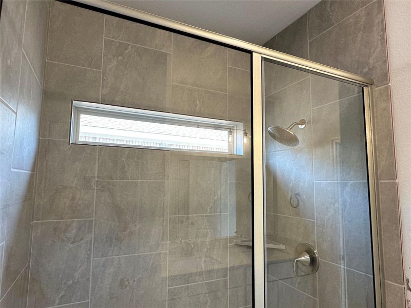 Full bathroom featuring a stall shower