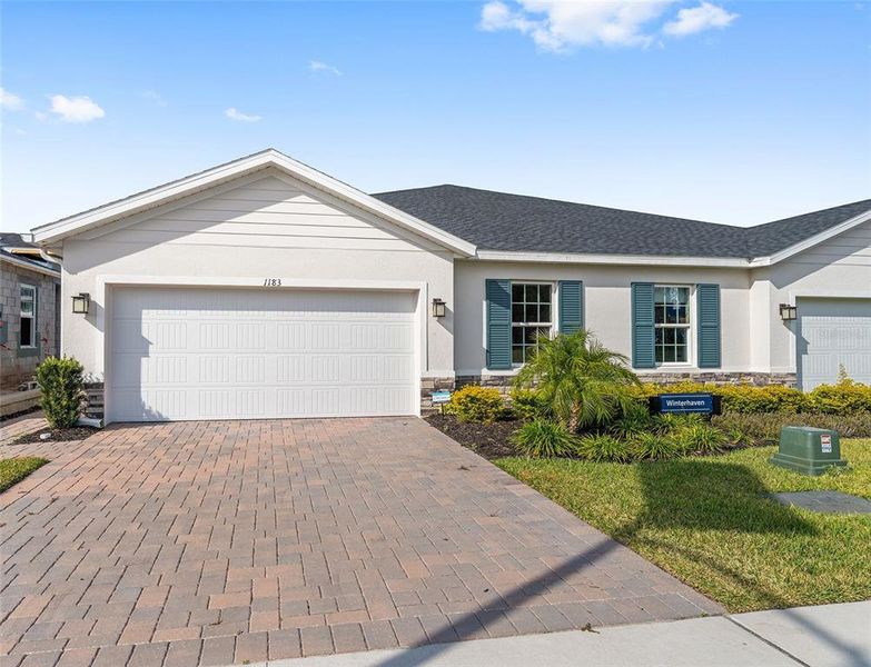 Front exterior of a new home in , Lady Lake, FL, highlighting curb appeal (Image 20). Front exterior of a new home in , Lady Lake, FL, highlighting curb appeal (Image 20).