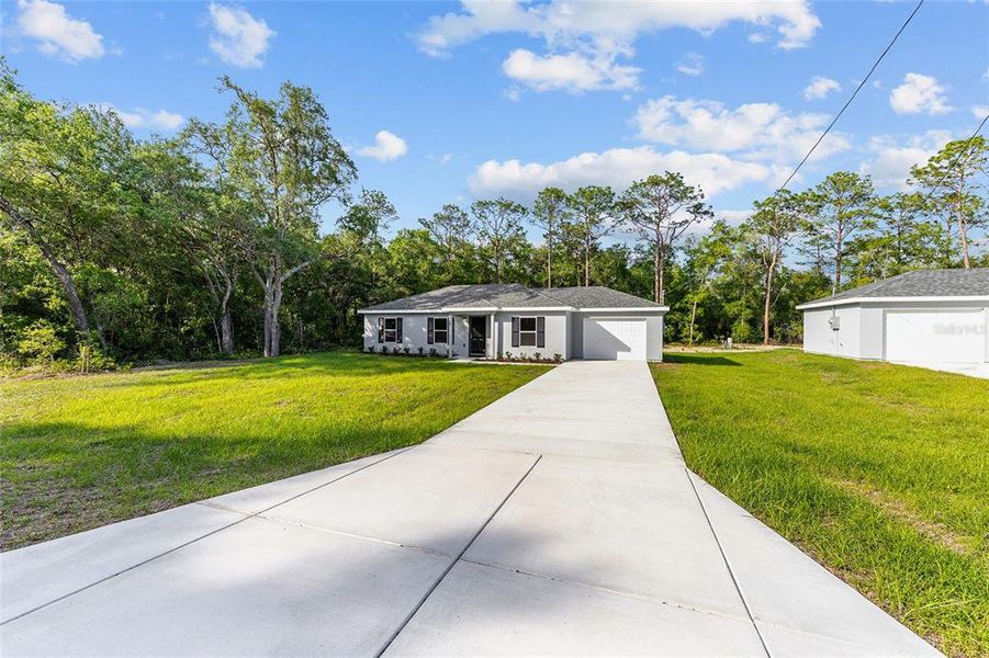 Front exterior of a new home in , Ocala, FL, highlighting curb appeal (Image 16).