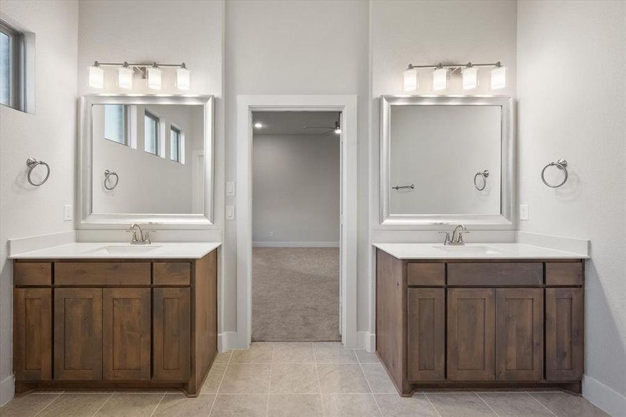 Another view of separate vanities.