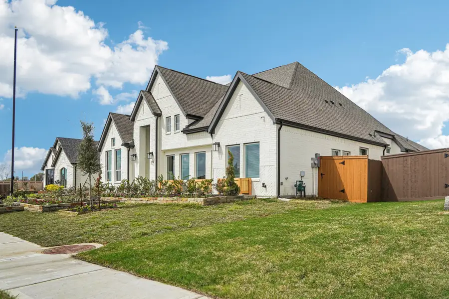 Front exterior of a new home in Wildrye, Waller, TX, highlighting curb appeal (Image 23).