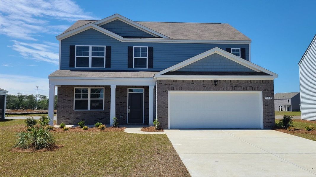 Representative exterior photo of a completed home built from the ELLE by D.R. Horton in Lochaven, Conway, SC (Image 12).