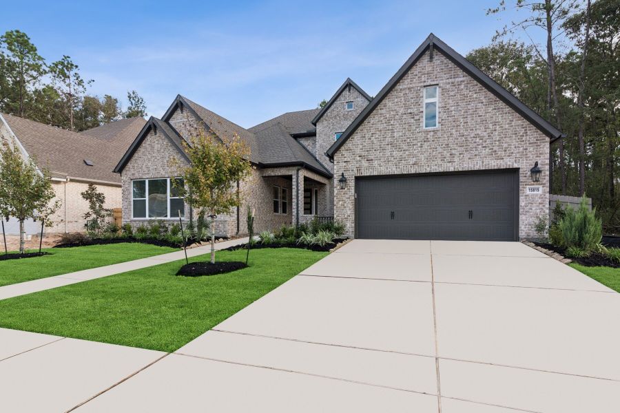 Front exterior of a new home in ARTAVIA 65' Homesites, Conroe, TX, highlighting curb appeal (Image 2).