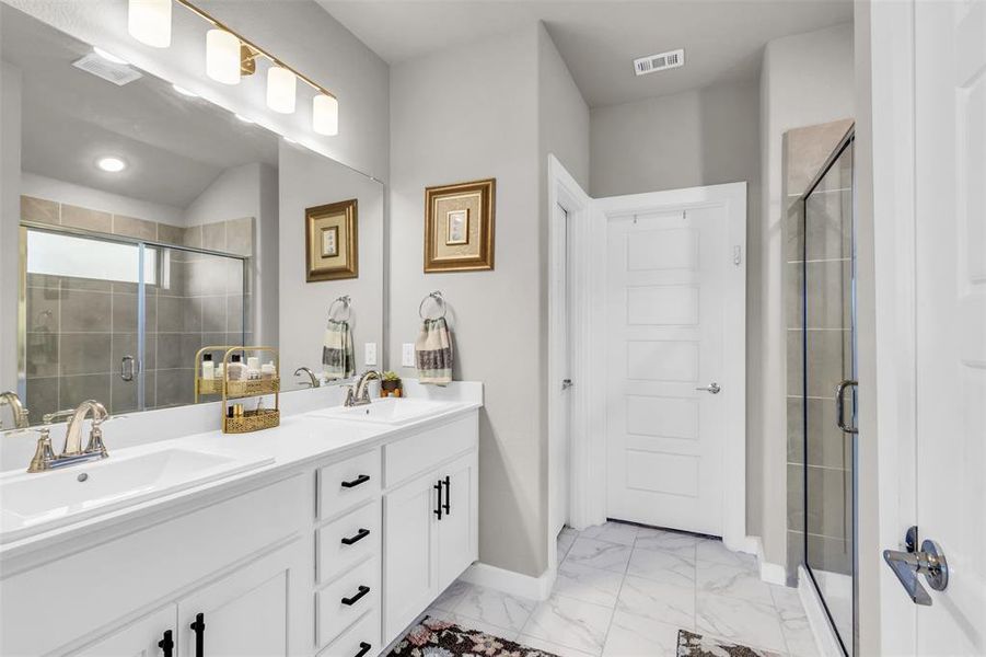 Bathroom featuring vanity and walk in shower