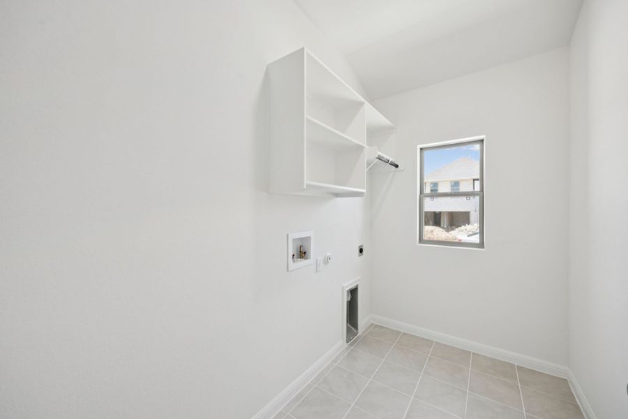 Utility Room in the Cypress home plan by Trophy Signature Homes - REPRESENTATIVE PHOTO