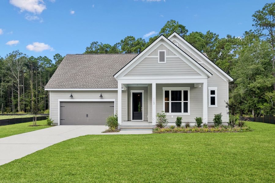 Front exterior of a new home in Hidden Ponds Reserve, Awendaw, SC, highlighting curb appeal (Image 28). Front exterior of a new home in Hidden Ponds Reserve, Awendaw, SC, highlighting curb appeal (Image 28).