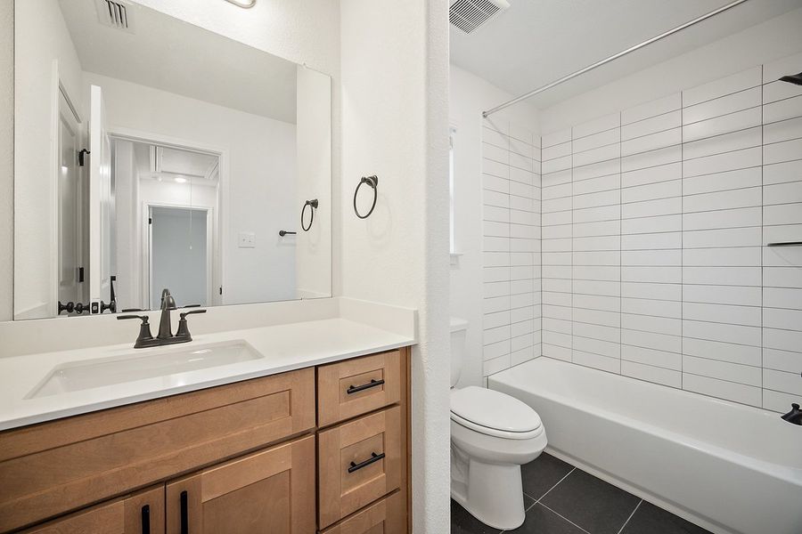 Furnished interior view inside a new home in The Hills of Bear Creek, Manchaca (Image 12).