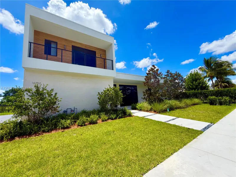 Front exterior of a new home in , Weston, FL, highlighting curb appeal (Image 2). Front exterior of a new home in , Weston, FL, highlighting curb appeal (Image 2).