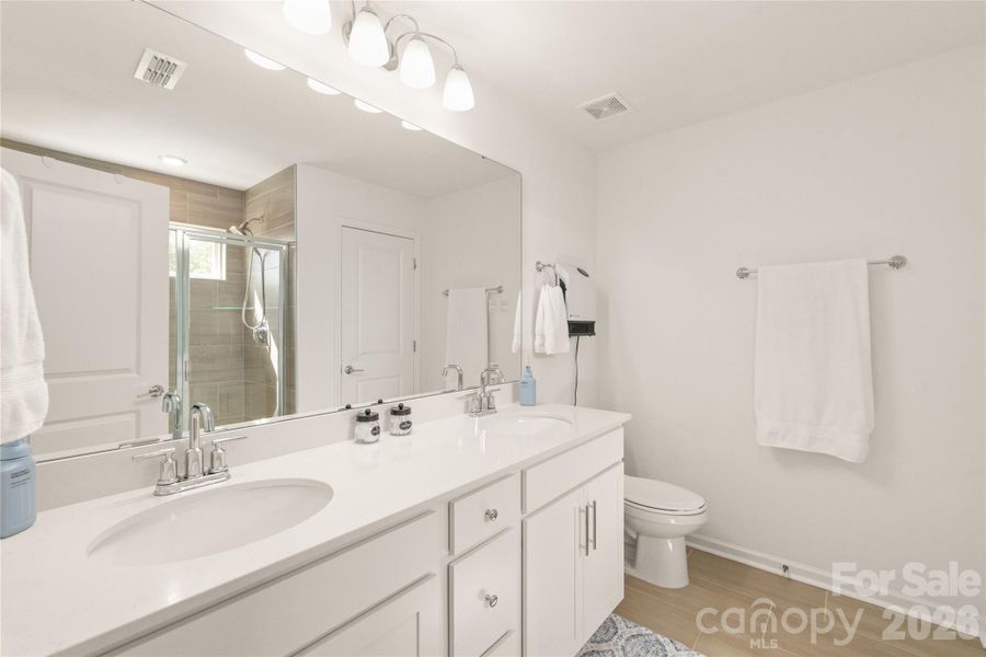 Primary bath offers dual sinks with plenty of counter space