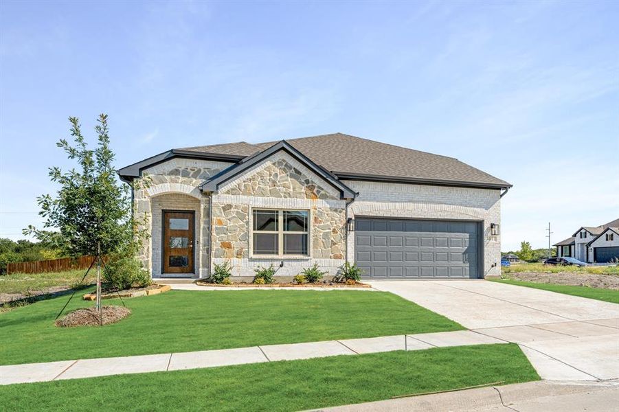 Front exterior of a new home in Bear Creek Elements, Lavon, TX, highlighting curb appeal (Image 2).