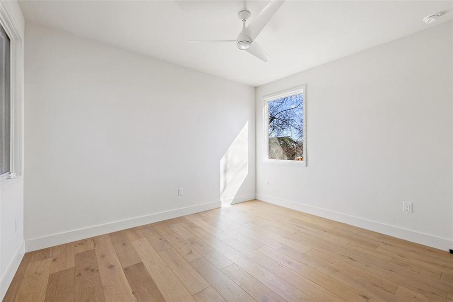 The upper-floor third bedroom showcases a harmonious blend of style and functionality, providing a welcoming retreat for guests or family members.