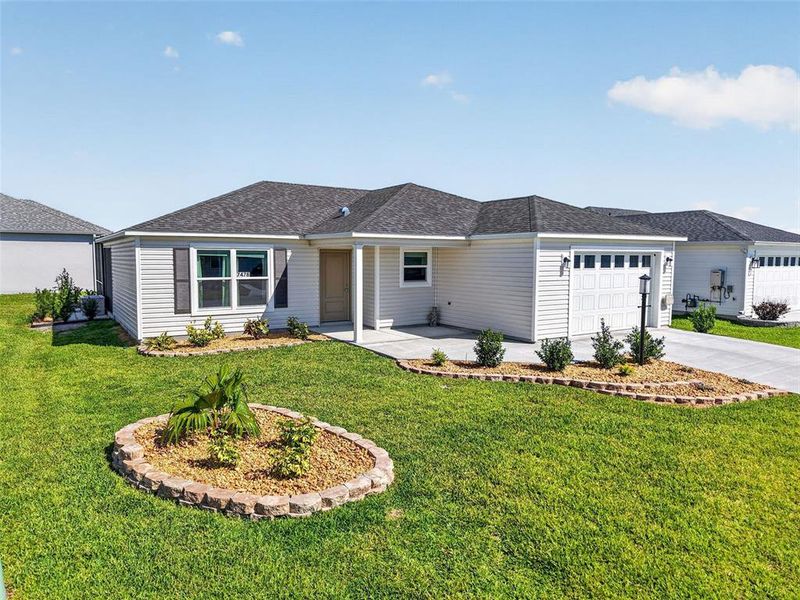 Front exterior of a new home in , The Villages, FL, highlighting curb appeal (Image 2). Front exterior of a new home in , The Villages, FL, highlighting curb appeal (Image 2).