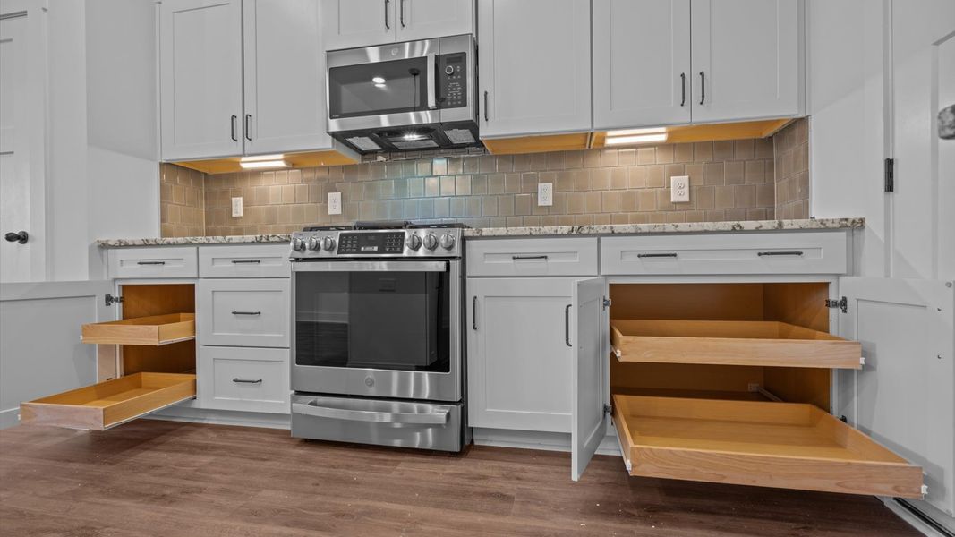 Stylish and efficient kitchen with a modest island and sleek, current design