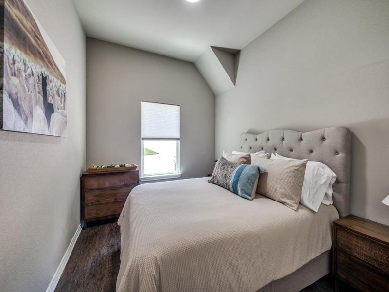 Bedroom with wood finished floors and baseboards Bedroom with wood finished floors and baseboards