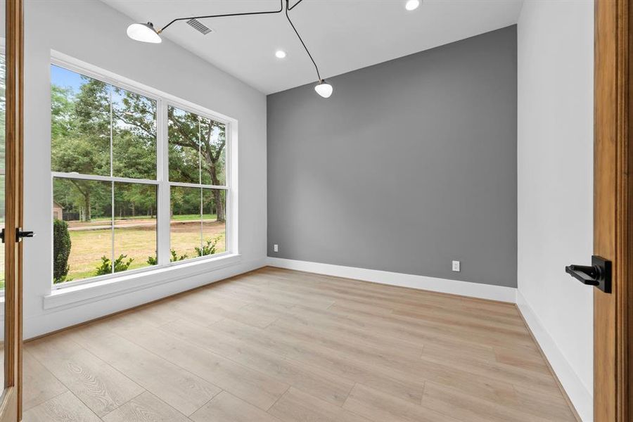 Front facing private study with glass French doors.