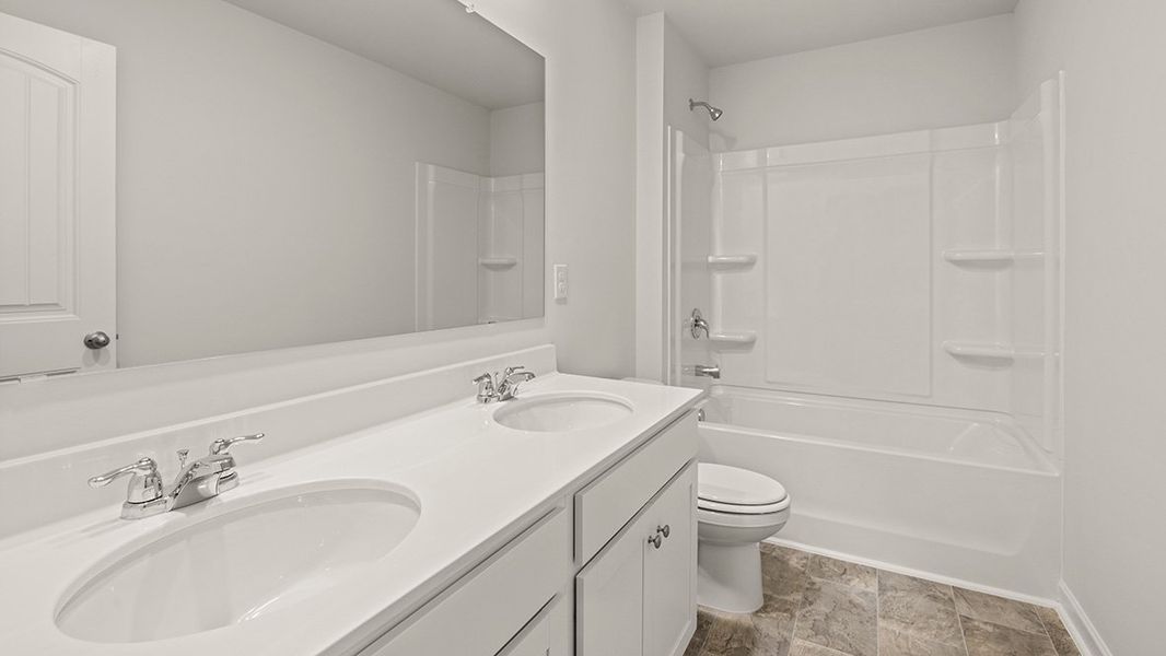 Representative furnished interior of a home built from the Hanover by D.R. Horton in Thompson Ridge, Dallas (Image 10).