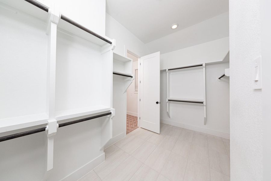 Look at this immaculate closet! With high shelving, multiple rows to hang clothing, you are sure to have enough room for all your belongings! This closet also features a convenient access door directly into the laundry room. Look at this immaculate closet! With high shelving, multiple rows to hang clothing, you are sure to have enough room for all your belongings! This closet also features a convenient access door directly into the laundry room.