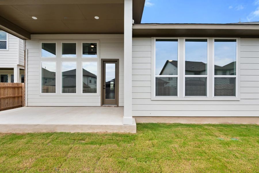 Front exterior of a new home in Arbor Collection at Lariat, Liberty Hill, TX, highlighting curb appeal (Image 28). Front exterior of a new home in Arbor Collection at Lariat, Liberty Hill, TX, highlighting curb appeal (Image 28).