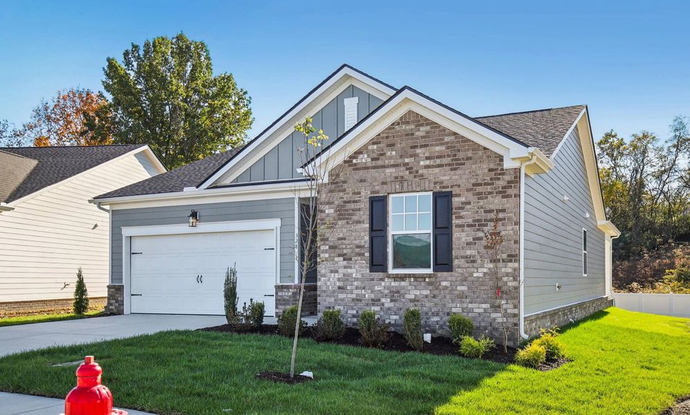 Front exterior of a new home in Cedars at Cane Ridge | 55+ Community, Antioch, TN, highlighting curb appeal (Image 23). Front exterior of a new home in Cedars at Cane Ridge | 55+ Community, Antioch, TN, highlighting curb appeal (Image 23).