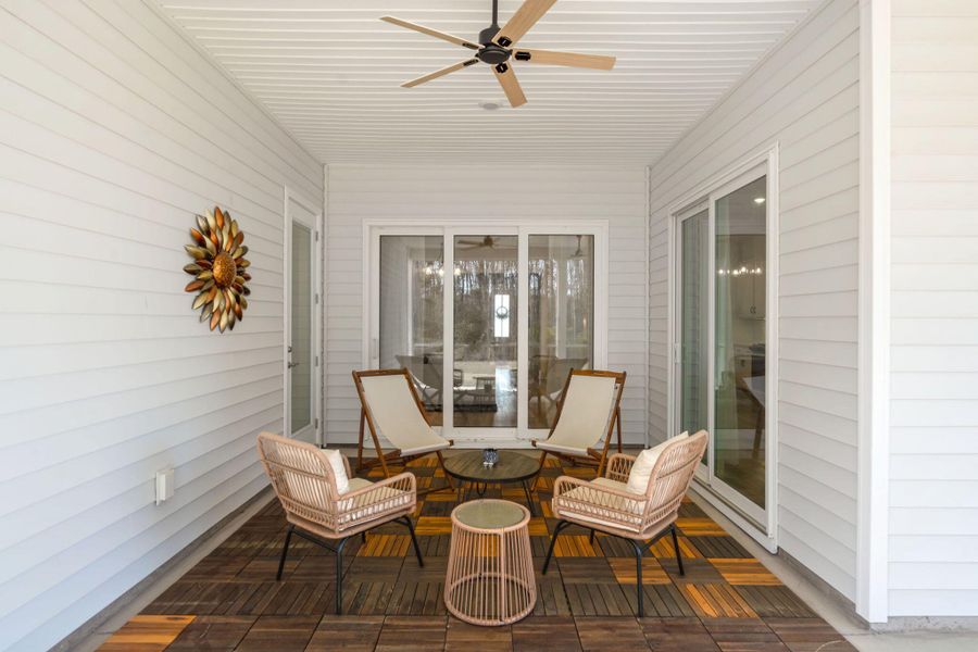 Exterior details and patio area of a home in Summerwind Crossing at Lakes of Cane Bay, Summerville (Image 25).