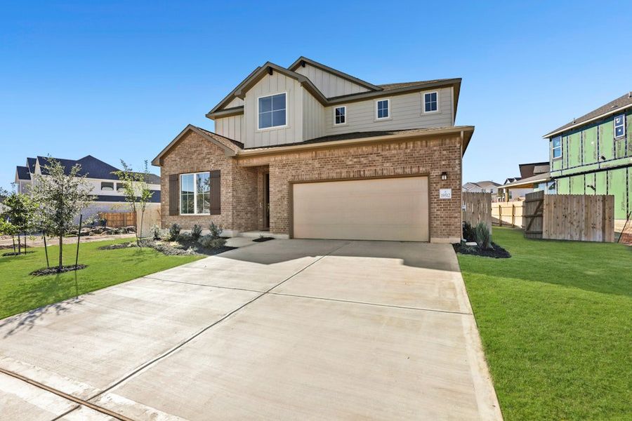 Front exterior of a new home in Blackhawk, Pflugerville, TX, highlighting curb appeal (Image 21).